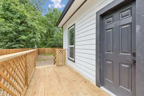 a view of outdoor space with wooden fence