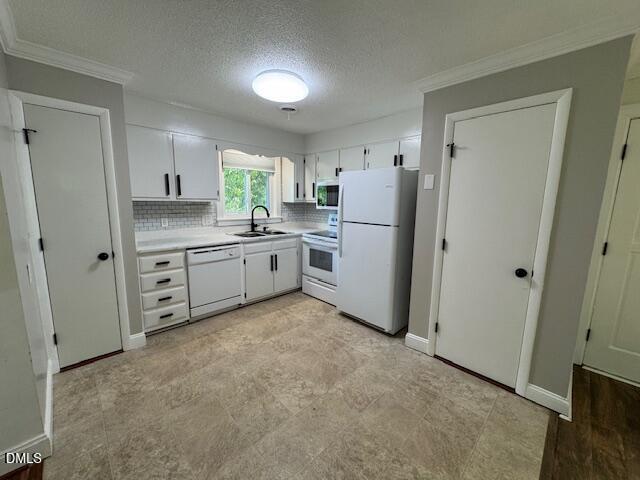 4100 Pittsford Road Raleigh, NC 27604 - Photo 7 of 14 a kitchen with white cabinets and white stainless steel appliances