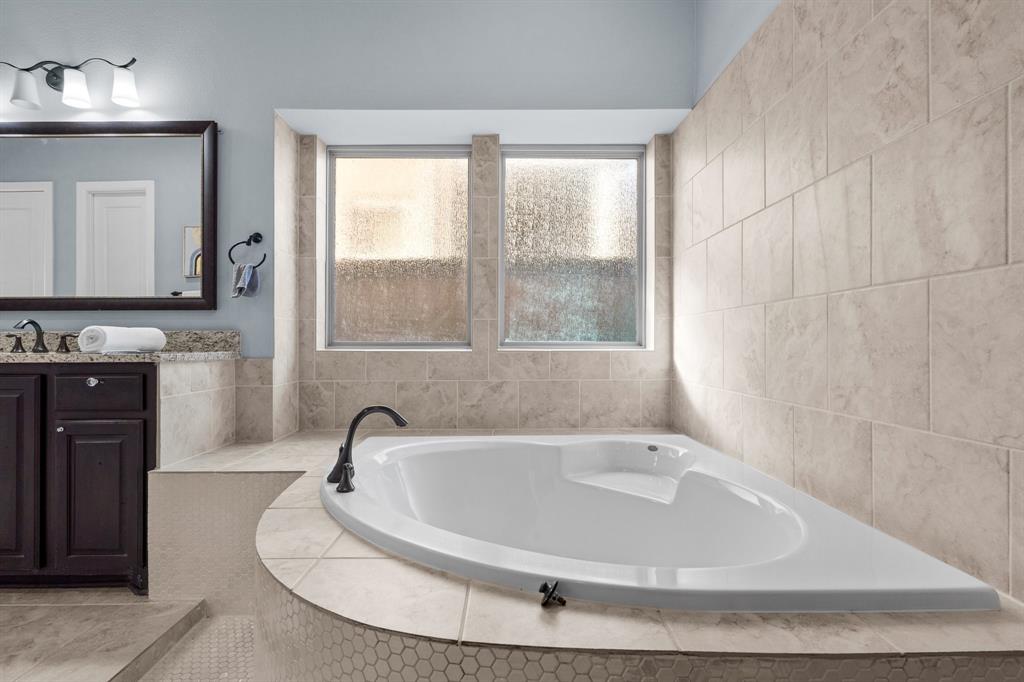 2812 Orchid Street Carrollton, TX 75007 - Photo 23 of 39 Full bath with vanity and a bath