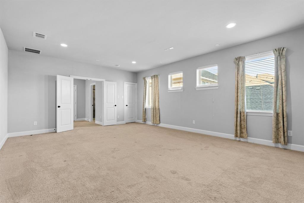 2812 Orchid Street Carrollton, TX 75007 - Photo 25 of 39 Unfurnished bedroom with recessed lighting and light carpet