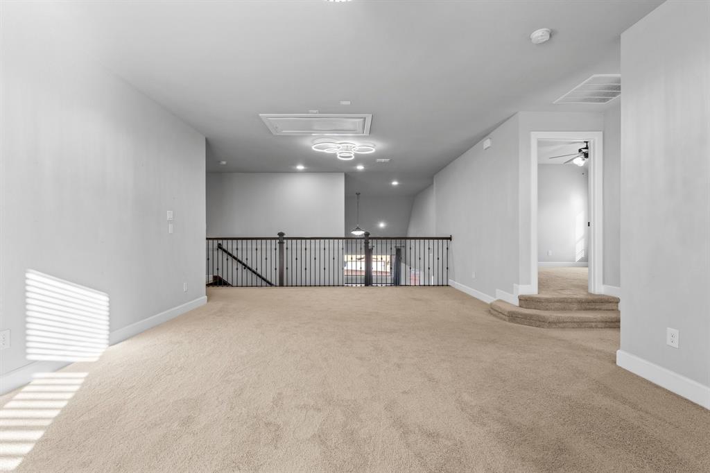 2812 Orchid Street Carrollton, TX 75007 - Photo 28 of 39 Unfurnished room featuring a ceiling fan, light carpet, and recessed lighting