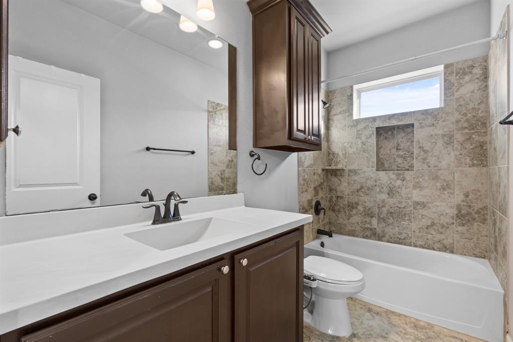 2812 Orchid Street Carrollton, TX 75007 - Photo 29 of 39 Bathroom featuring tub / shower combination and vanity