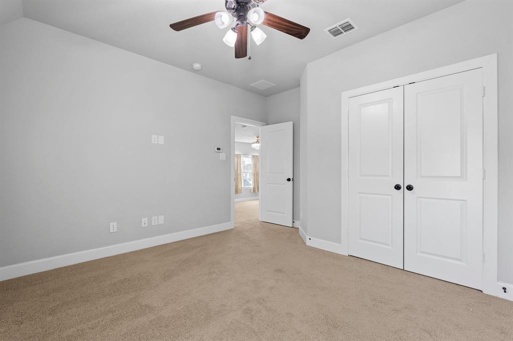 2812 Orchid Street Carrollton, TX 75007 - Photo 31 of 39 Unfurnished bedroom featuring carpet, ceiling fan, and a closet