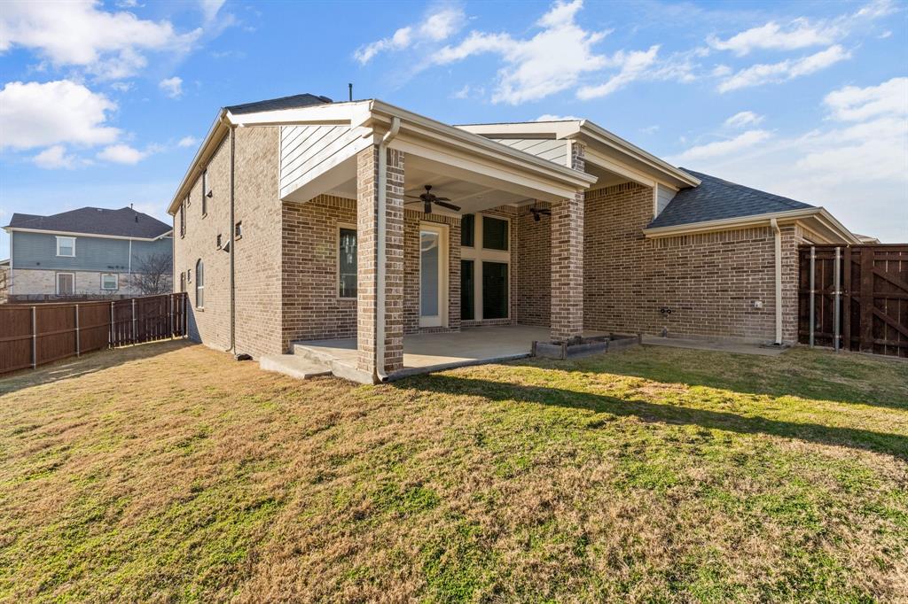 2812 Orchid Street Carrollton, TX 75007 - Photo 35 of 39 Rear view of property with a fenced backyard, ceiling fan, a patio, and brick siding