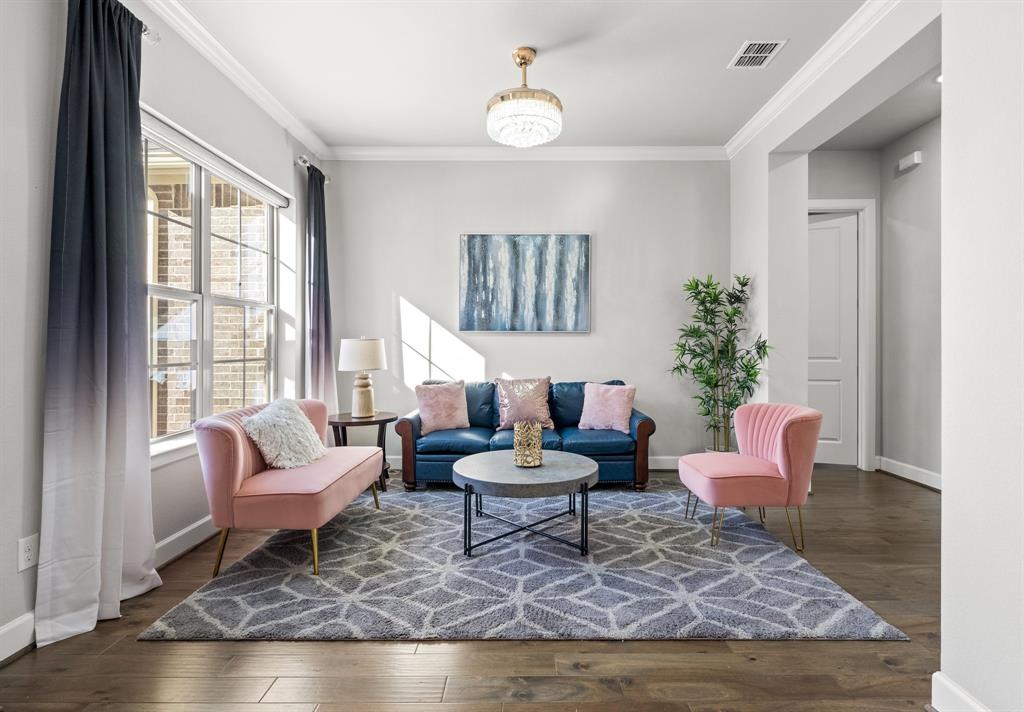 2812 Orchid Street Carrollton, TX 75007 - Photo 4 of 39 Living area featuring crown molding and dark wood finished floors