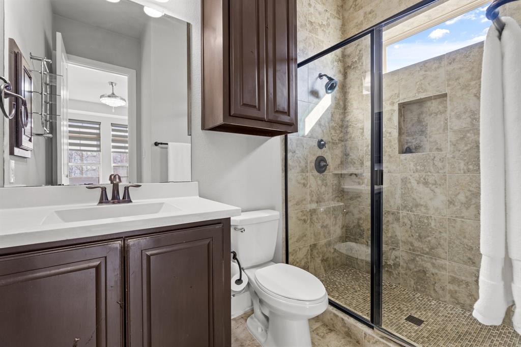 2812 Orchid Street Carrollton, TX 75007 - Photo 9 of 39 Full bath with plenty of natural light, vanity, and a shower stall