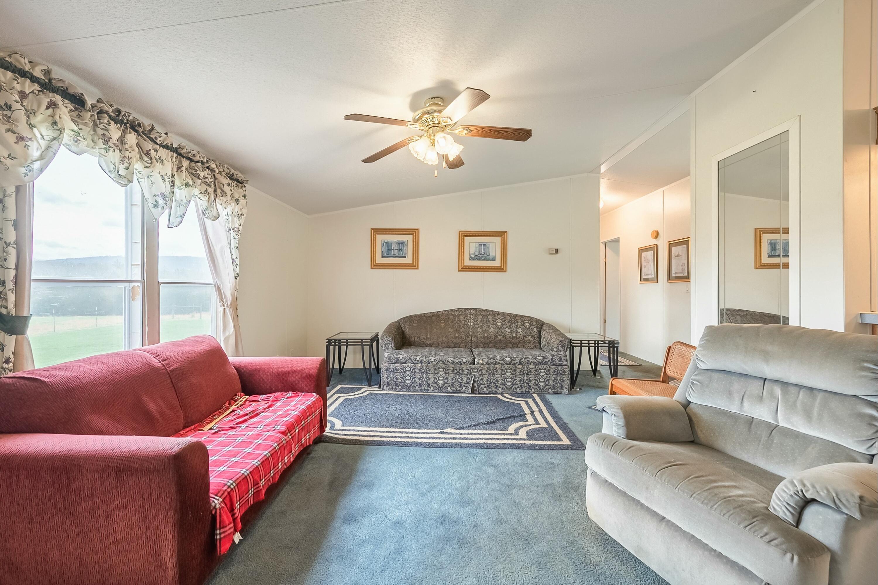 3588 Flatwoods Road Elliston, VA 24087 - Photo 11 of 119 a living room with furniture and a large window