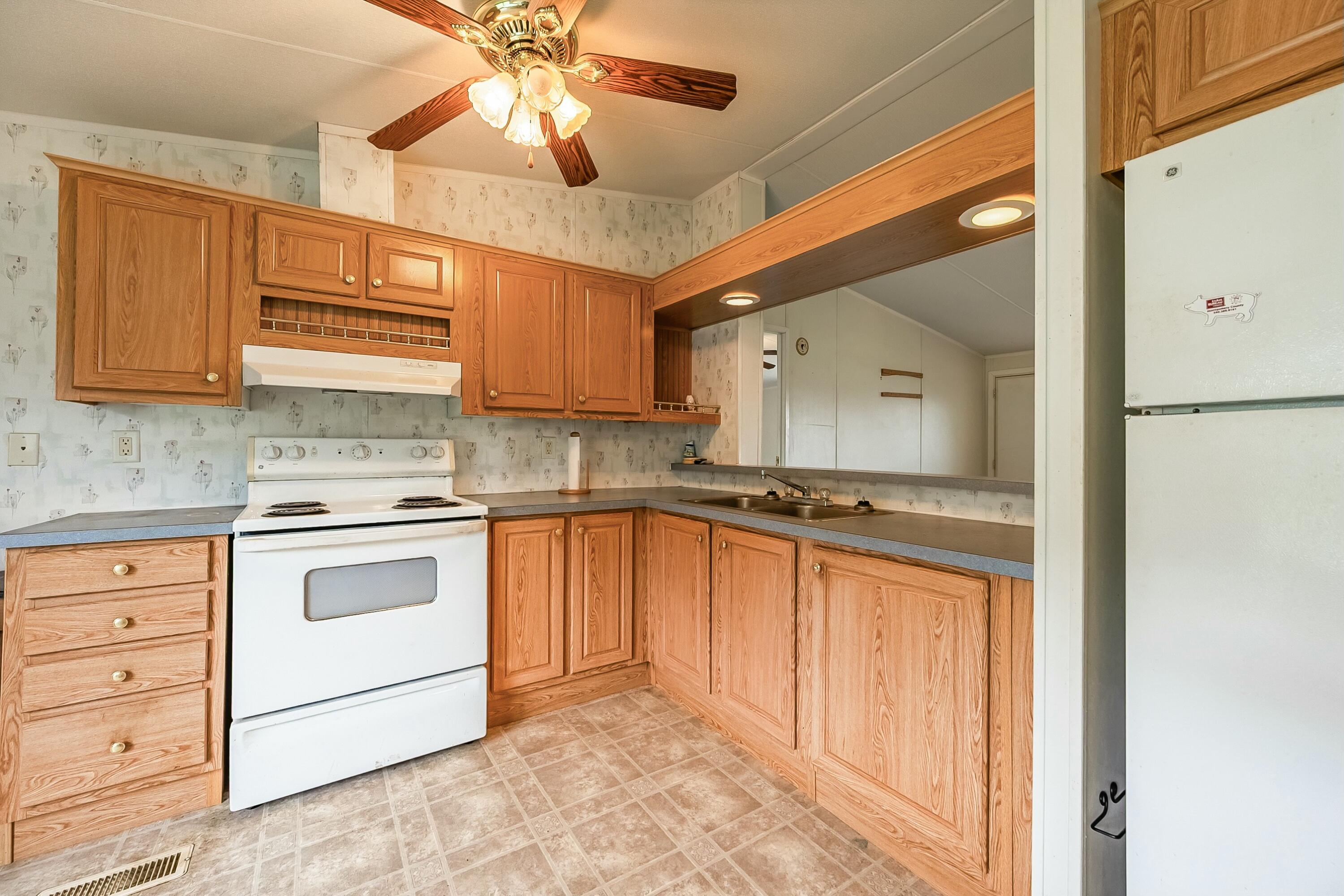 3588 Flatwoods Road Elliston, VA 24087 - Photo 17 of 119 a kitchen with stainless steel appliances granite countertop a sink and cabinets