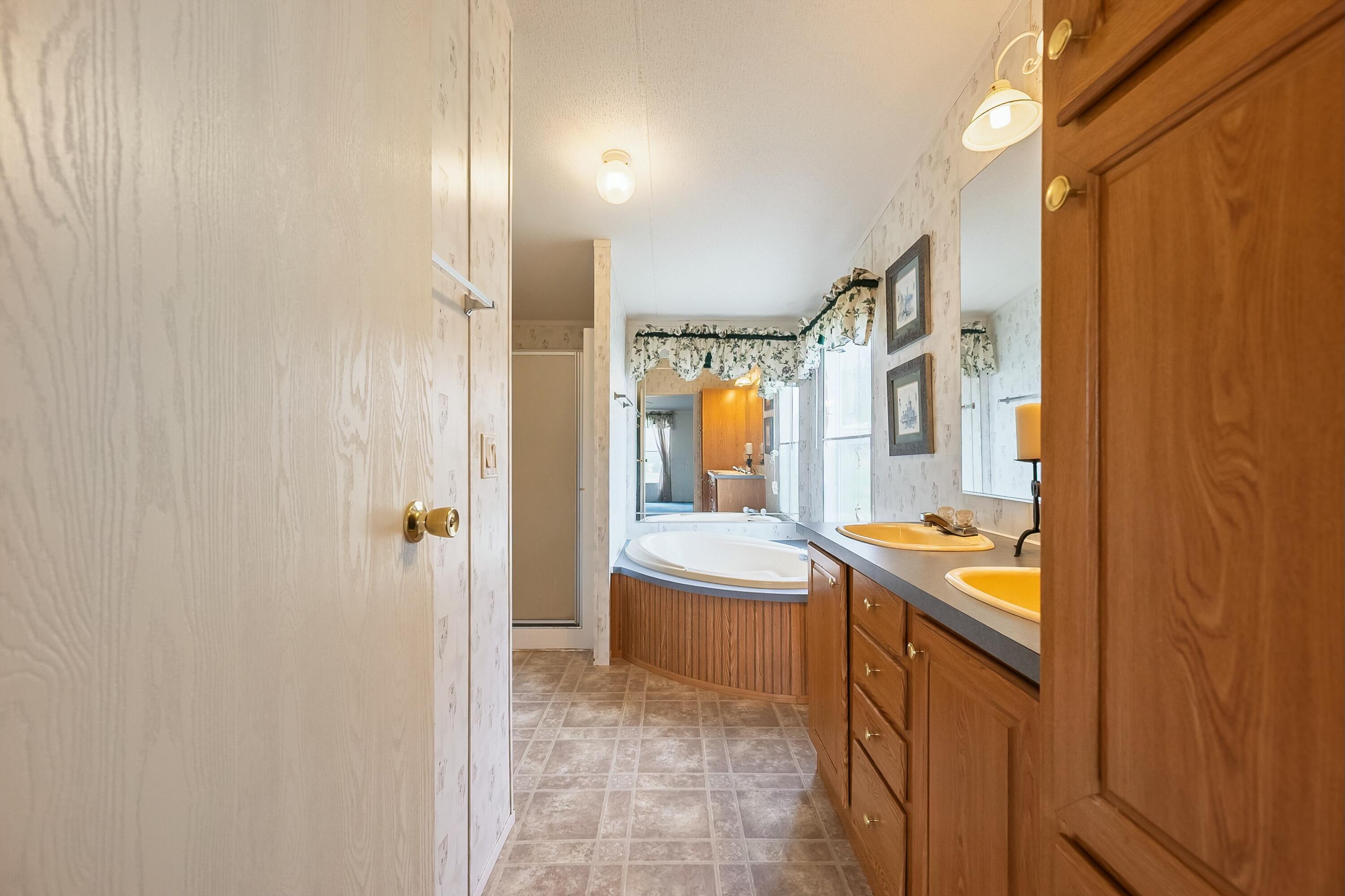 3588 Flatwoods Road Elliston, VA 24087 - Photo 37 of 119 a bathroom with sink and mirror