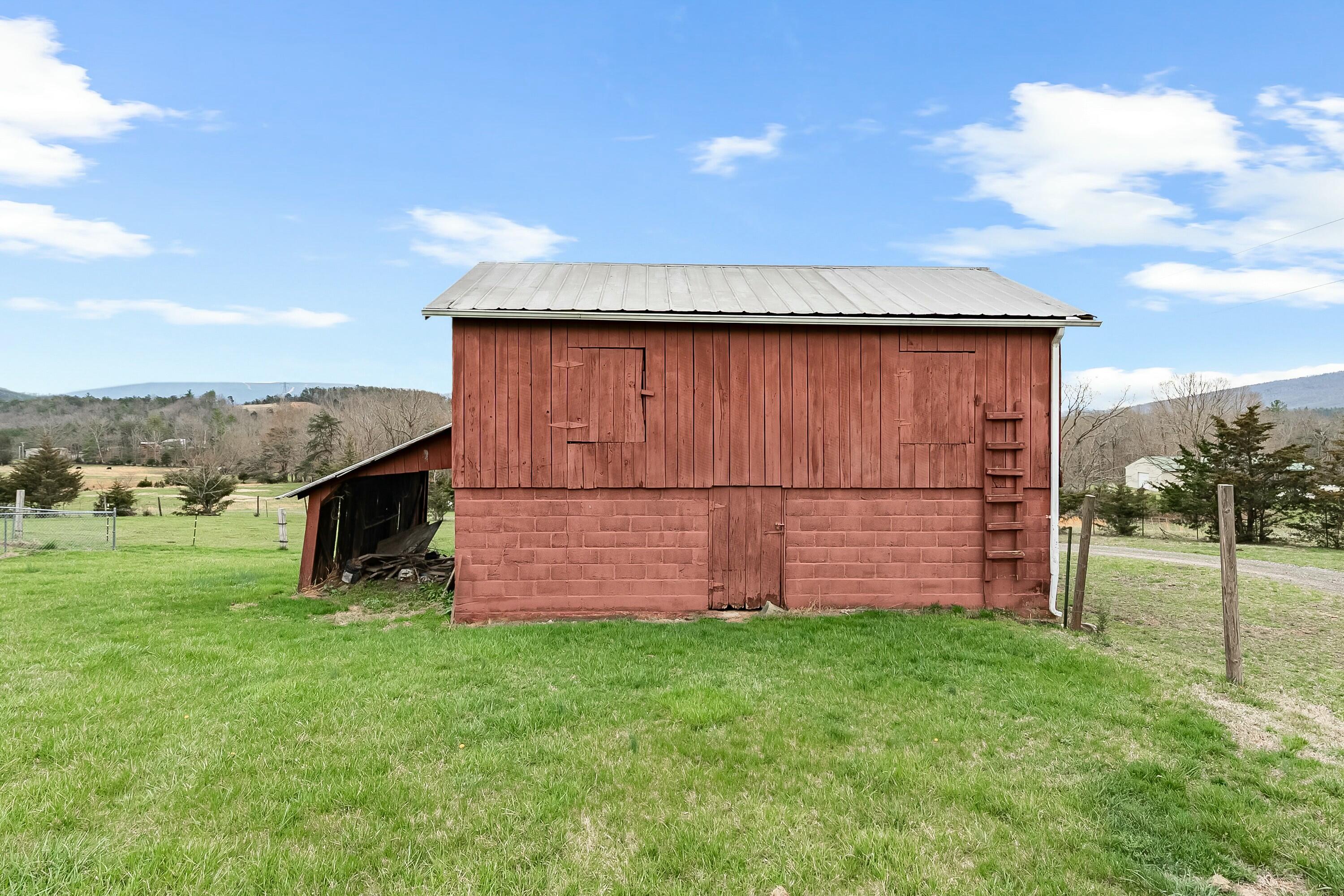 3588 Flatwoods Road Elliston, VA 24087 - Photo 44 of 119 a view of a backyard with wooden fence