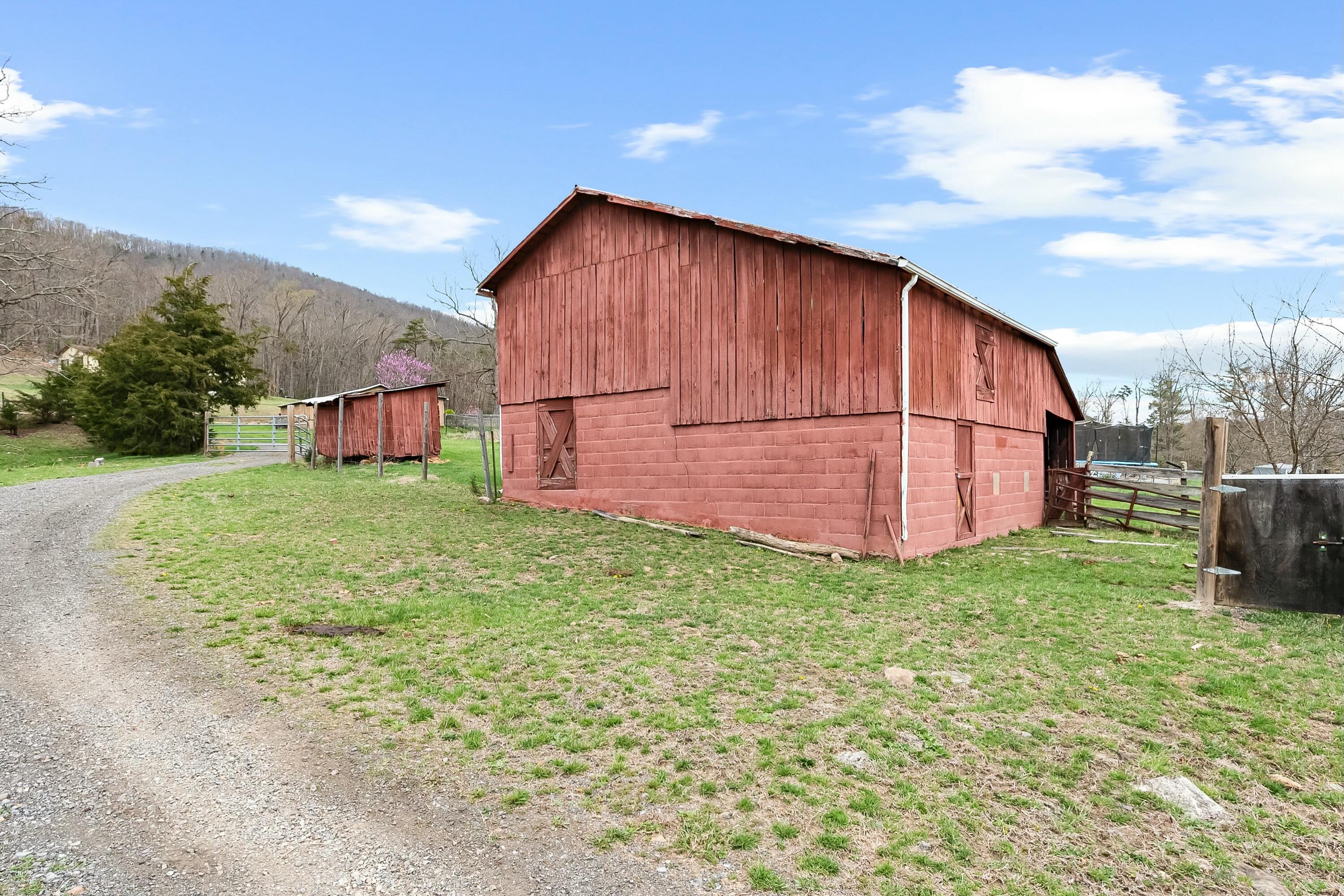 3588 Flatwoods Road Elliston, VA 24087 - Photo 47 of 119 a backyard of a house with lots of green space