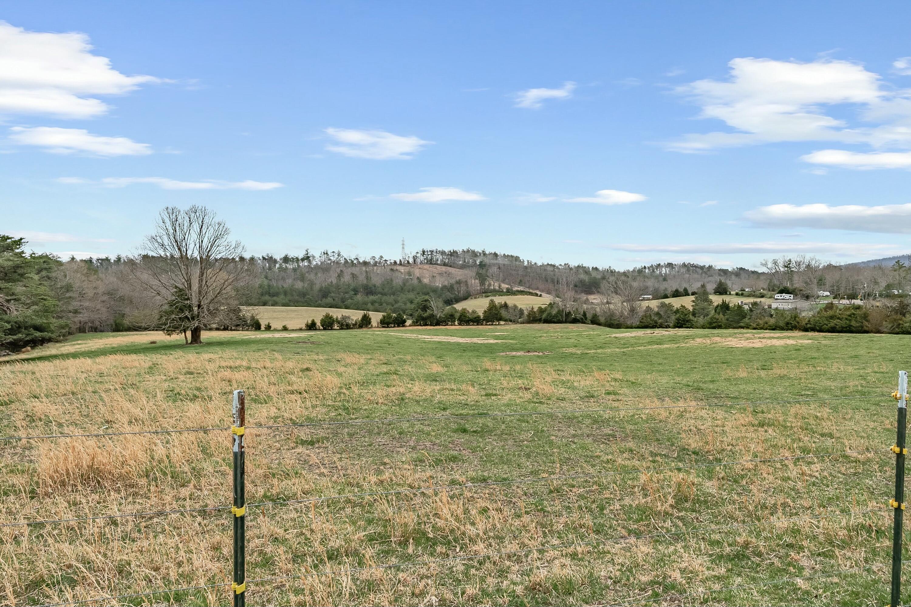 3588 Flatwoods Road Elliston, VA 24087 - Photo 82 of 119 a view of a lake with houses in the back