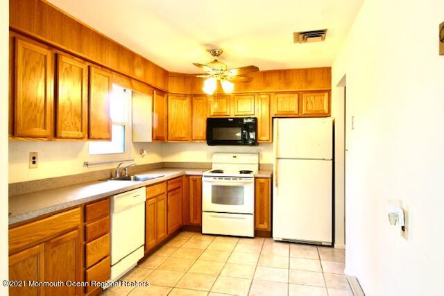 8 Patmore Road Brick, NJ 08724 - Photo 3 of 10 a kitchen with stainless steel appliances a sink cabinets and a window