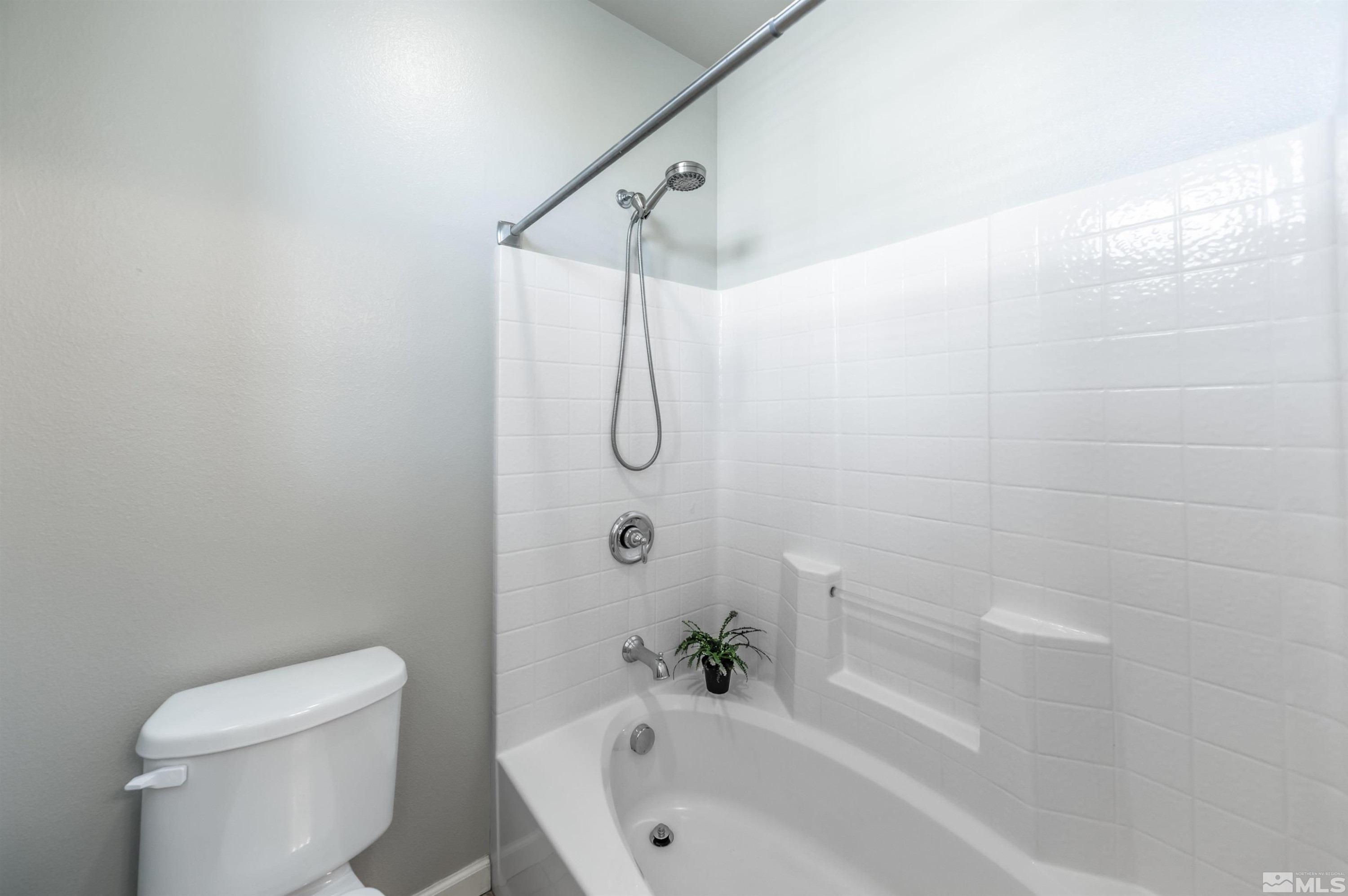 2490 Eastshore Place, Unit 602 Reno, NV 89509 - Photo 24 of 36 a bathroom with a toilet and shower