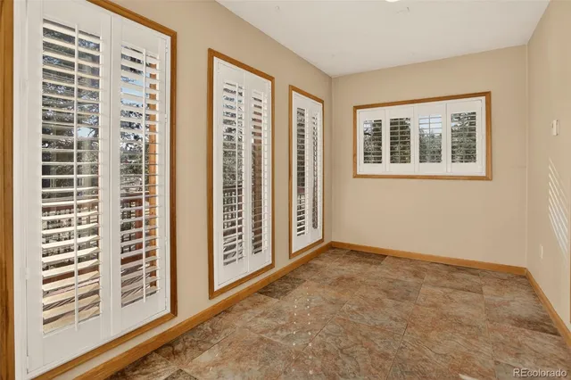 a view of an empty room with windows