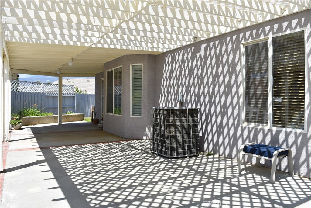 1665 Ravenswood Road Beaumont, CA 92223 - Photo 34 of 41 a porch with a chair and table