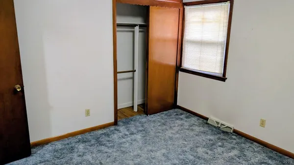 an empty room with mirror