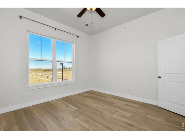 a living room with furniture a fireplace and a chandelier