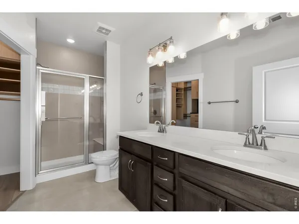 a room with lots of gym equipment and a large mirror