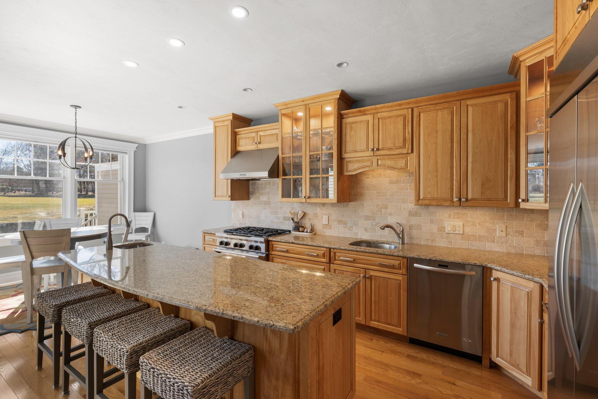16 Quinns Way Mashpee, MA 02649 - Photo 13 of 59 a kitchen with a sink a counter top space and stainless steel appliances