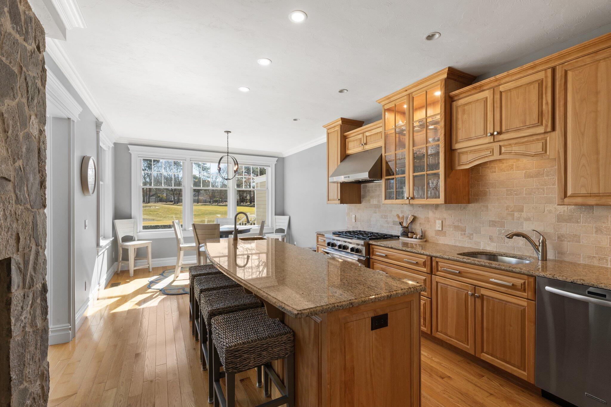 16 Quinns Way Mashpee, MA 02649 - Photo 14 of 59 a kitchen with a sink a stove and a refrigerator