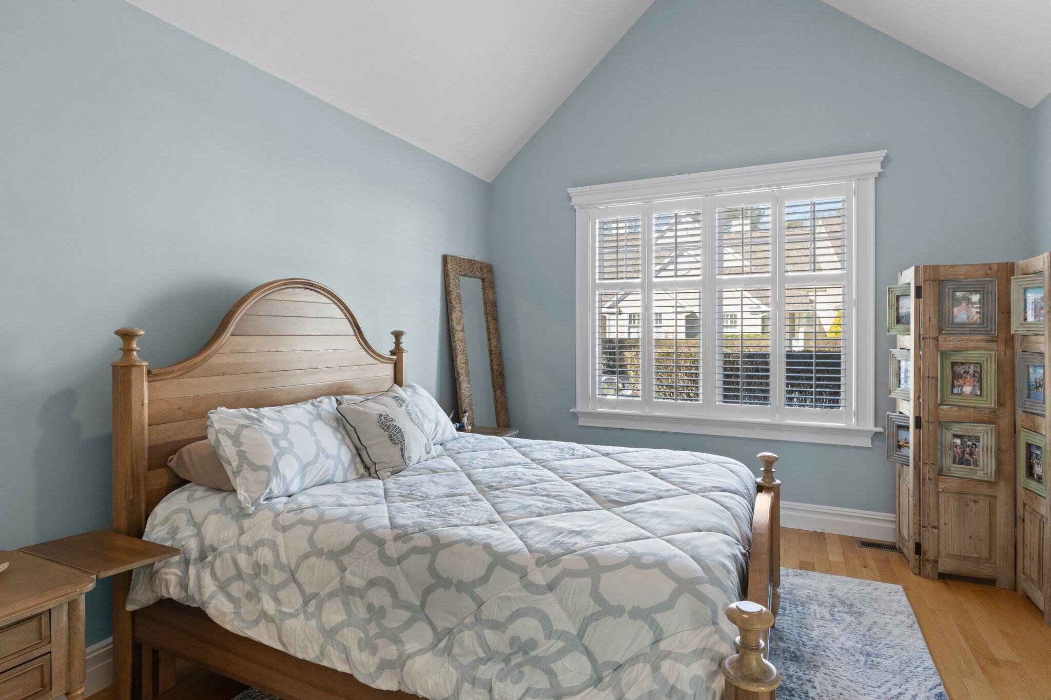 16 Quinns Way Mashpee, MA 02649 - Photo 15 of 59 a bedroom with a bed and wooden floor