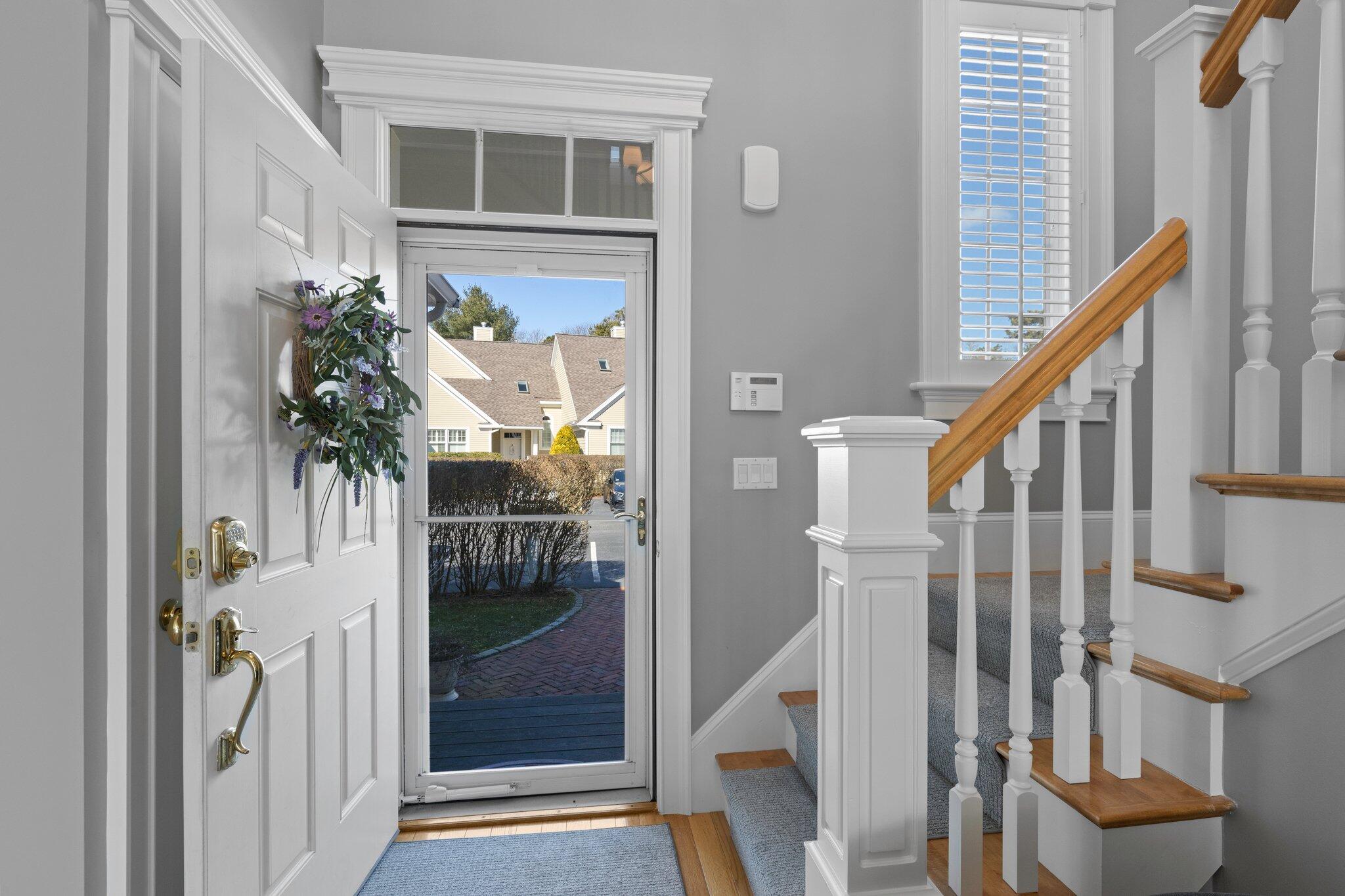 16 Quinns Way Mashpee, MA 02649 - Photo 2 of 59 a view of a hallway with wooden floor and entryway