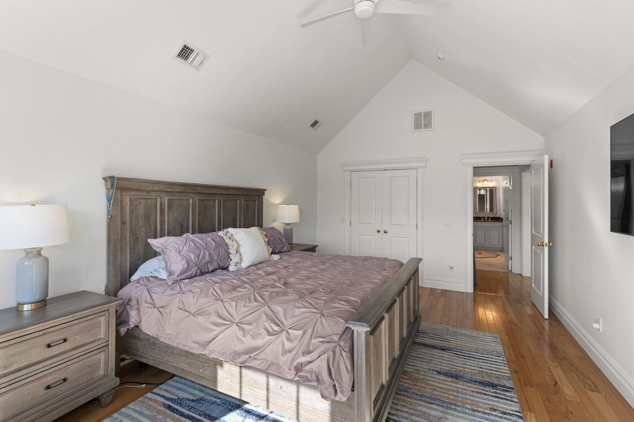 16 Quinns Way Mashpee, MA 02649 - Photo 24 of 59 a bedroom with a bed and wooden floor