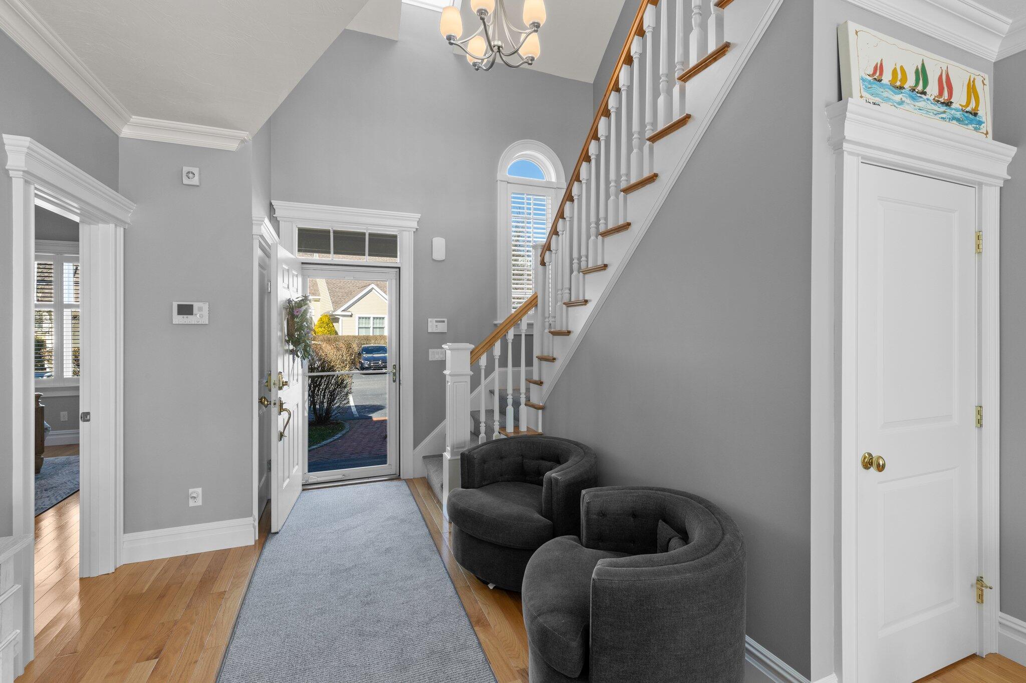 16 Quinns Way Mashpee, MA 02649 - Photo 3 of 59 a living room with furniture and stairs