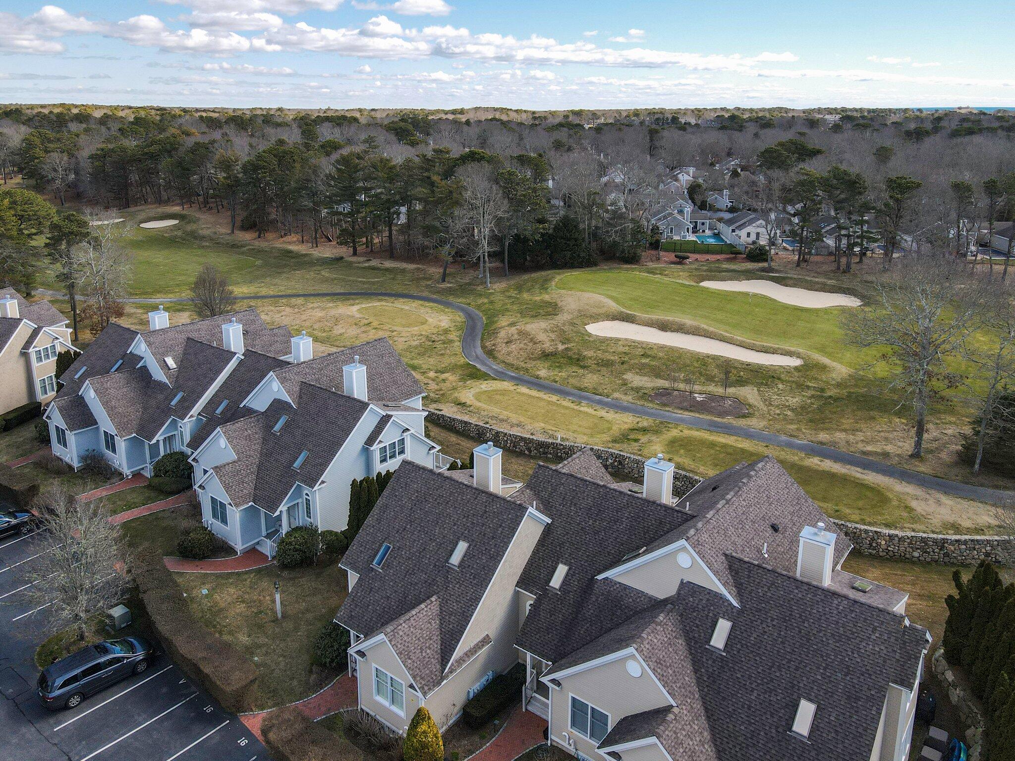 16 Quinns Way Mashpee, MA 02649 - Photo 44 of 59 an aerial view of residential houses with outdoor space and lake view