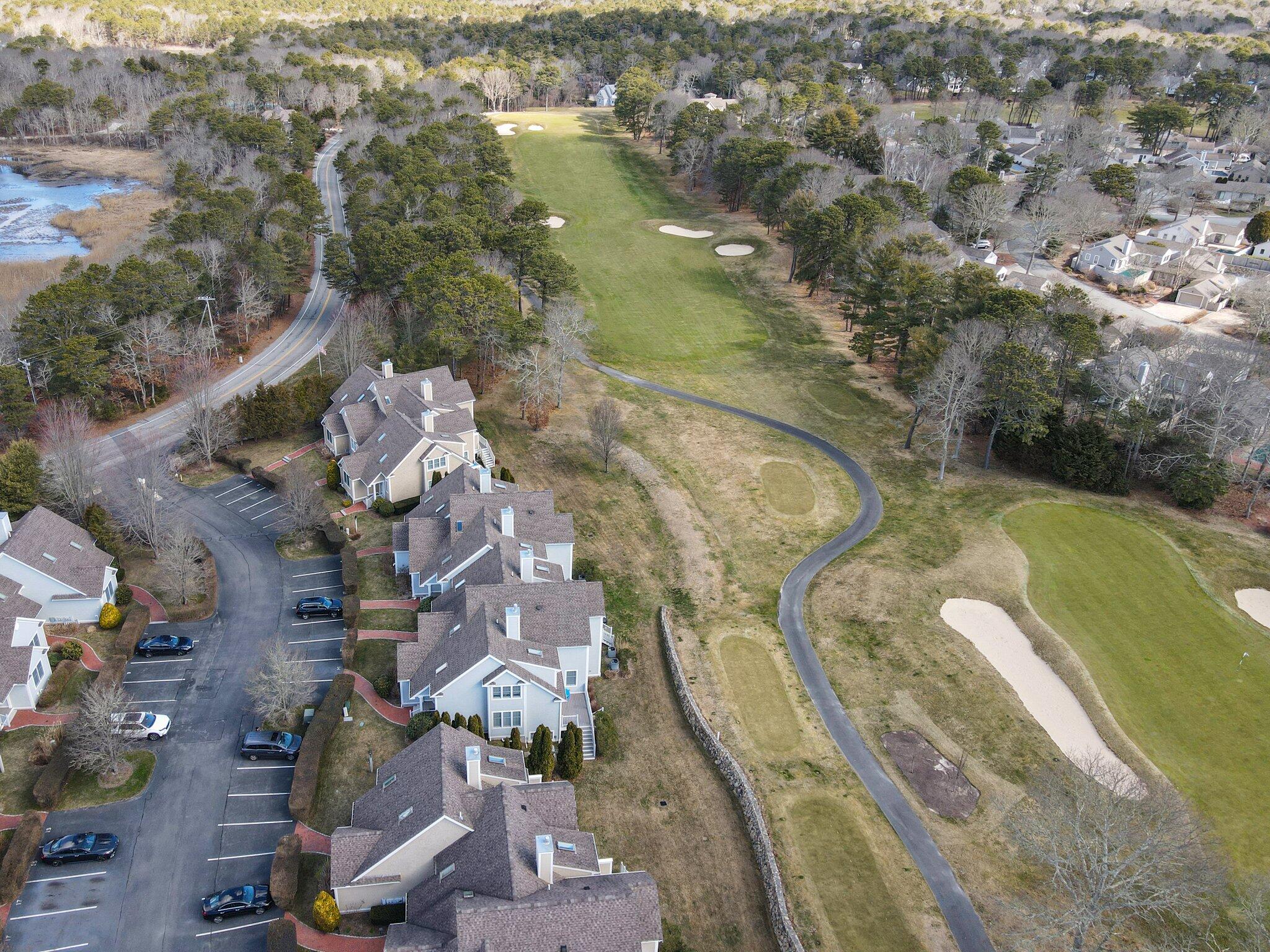 16 Quinns Way Mashpee, MA 02649 - Photo 45 of 59 an aerial view of a house with outdoor space and lake view