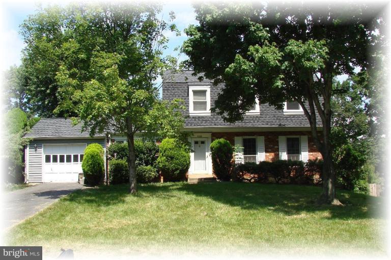 2326 Archdale Road Reston, VA 20191 - Photo 1 of 8 front view of a house with a small yard