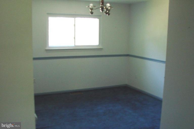 2326 Archdale Road Reston, VA 20191 - Photo 3 of 8 an empty room with a window