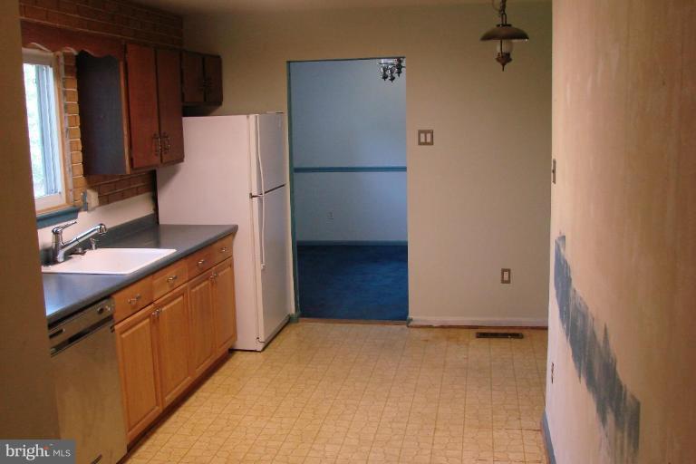 2326 Archdale Road Reston, VA 20191 - Photo 8 of 8 a kitchen with a refrigerator and a sink