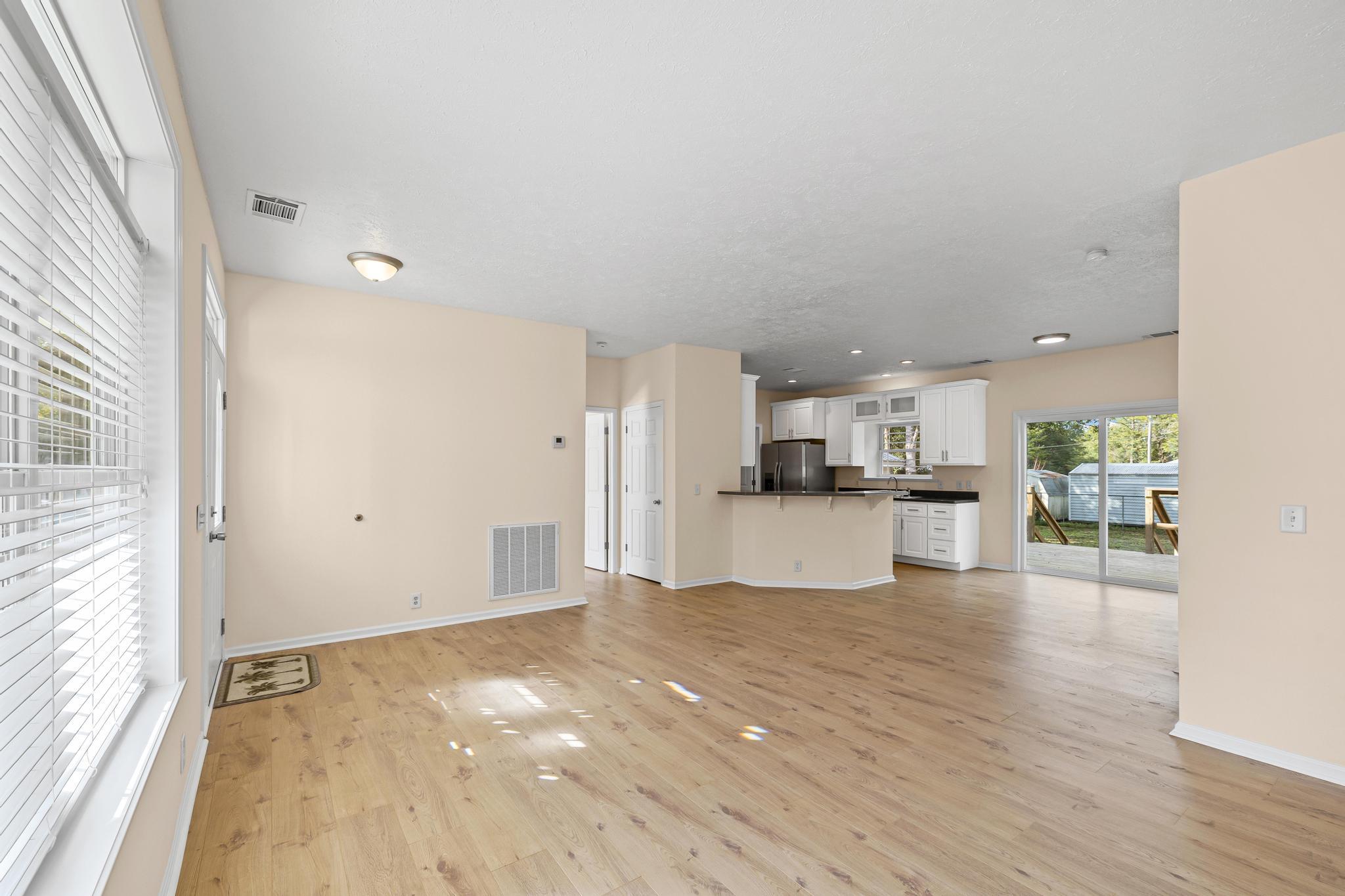 3159 Forrest Avenue Crestview, FL 32539 - Photo 12 of 41 a view of kitchen with wooden floor