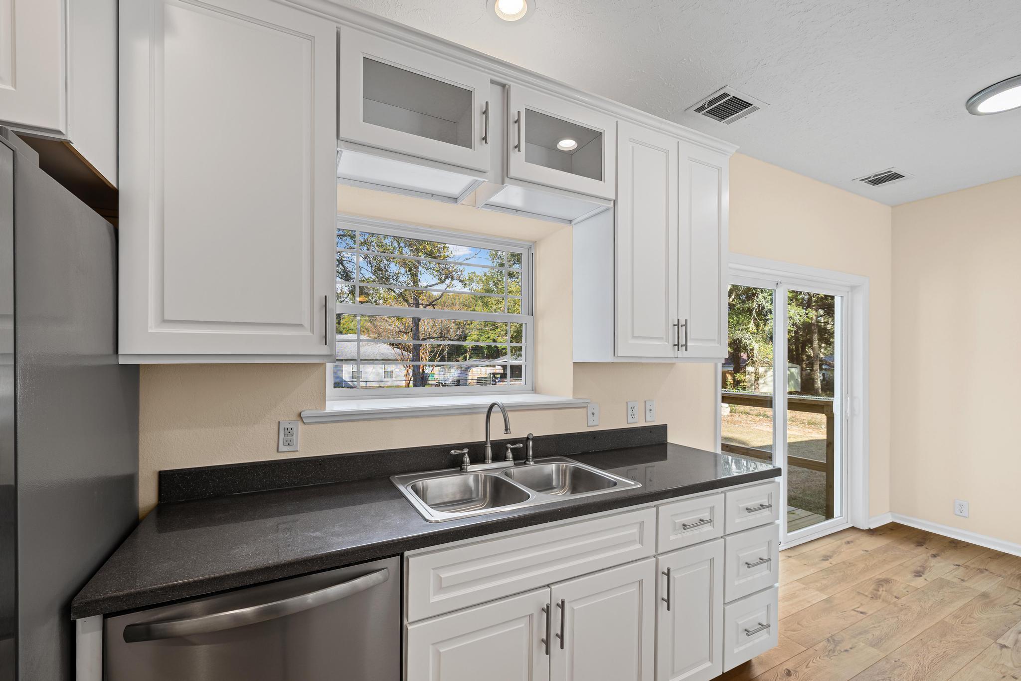 3159 Forrest Avenue Crestview, FL 32539 - Photo 16 of 41 a kitchen with appliances cabinets and a sink