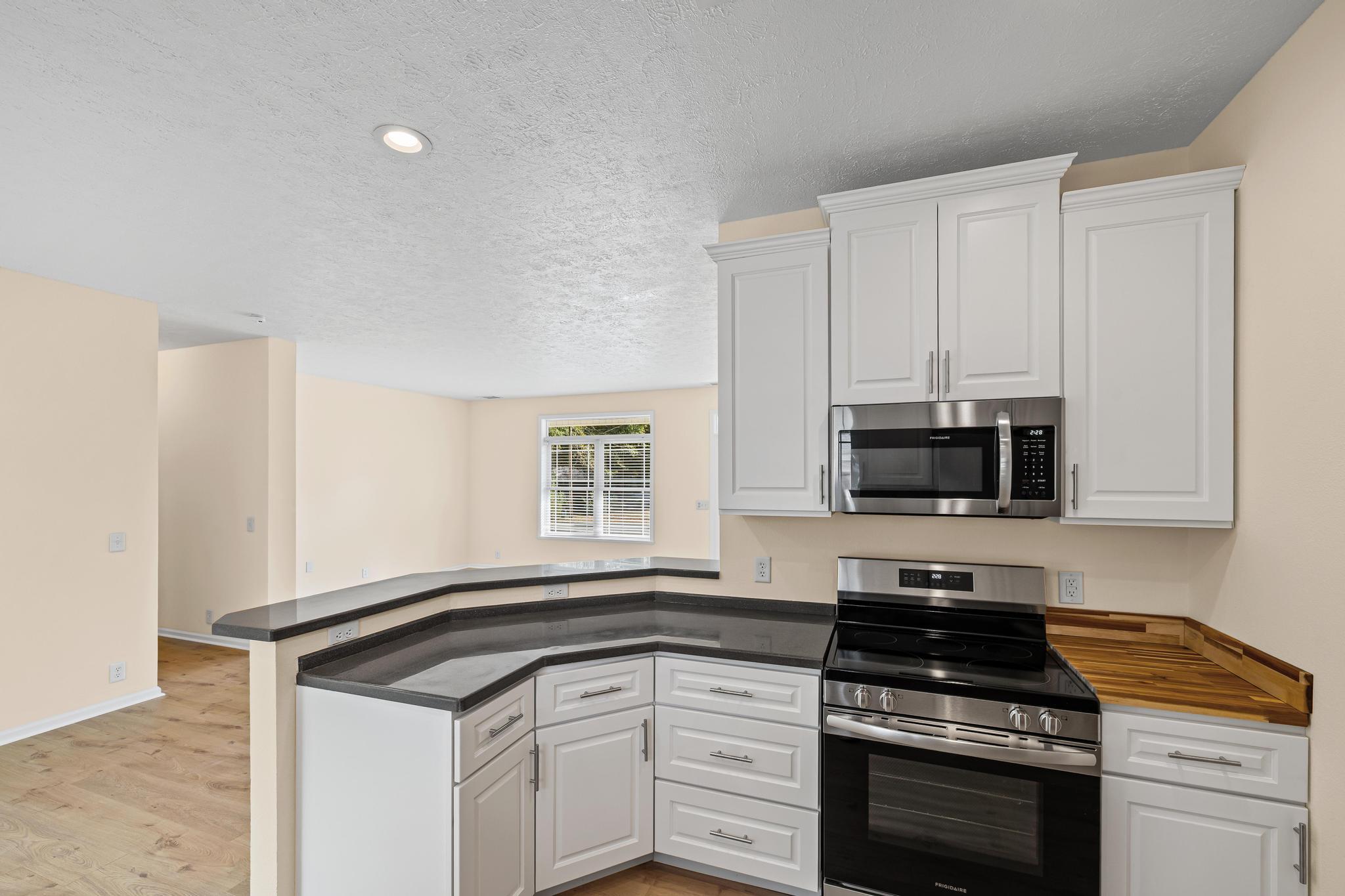 3159 Forrest Avenue Crestview, FL 32539 - Photo 18 of 41 a kitchen with a sink stove and microwave