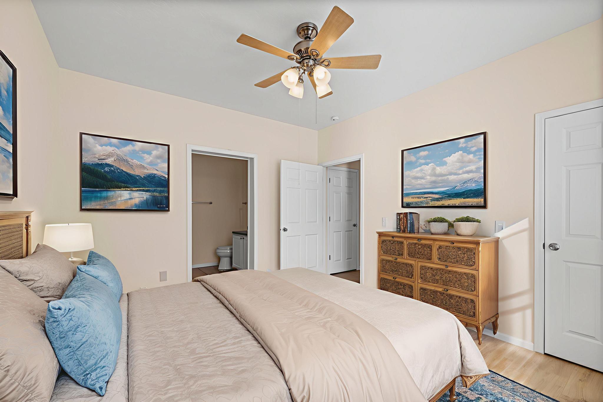 3159 Forrest Avenue Crestview, FL 32539 - Photo 22 of 41 a bedroom with a bed and a chandelier