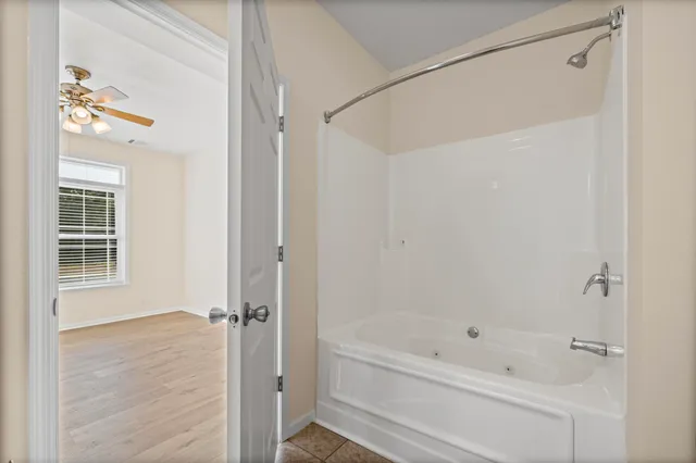 a bathroom with a bathtub and a shower