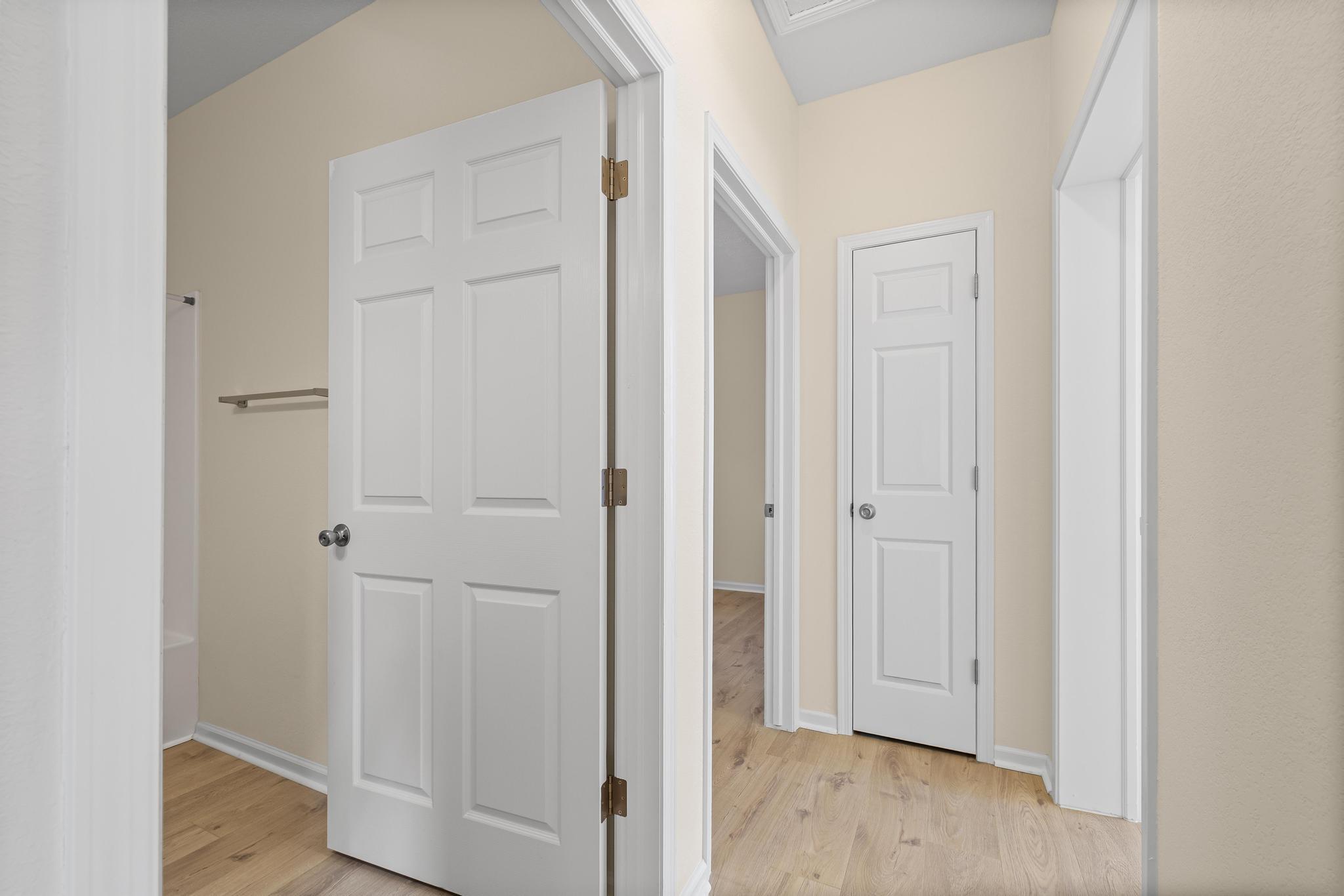 3159 Forrest Avenue Crestview, FL 32539 - Photo 26 of 41 a view of a hallway with wooden floor