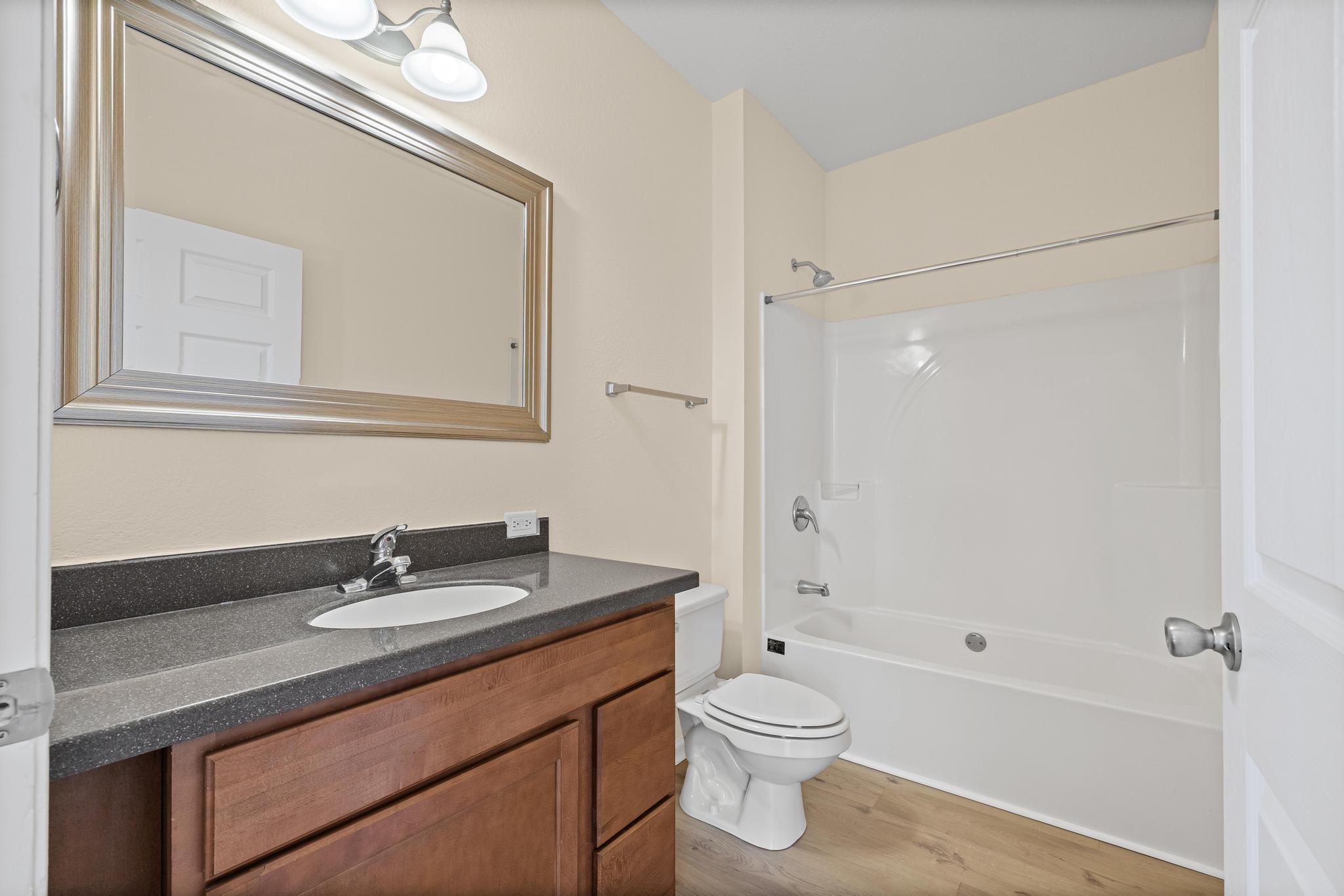 3159 Forrest Avenue Crestview, FL 32539 - Photo 27 of 41 a bathroom with a sink a toilet and shower