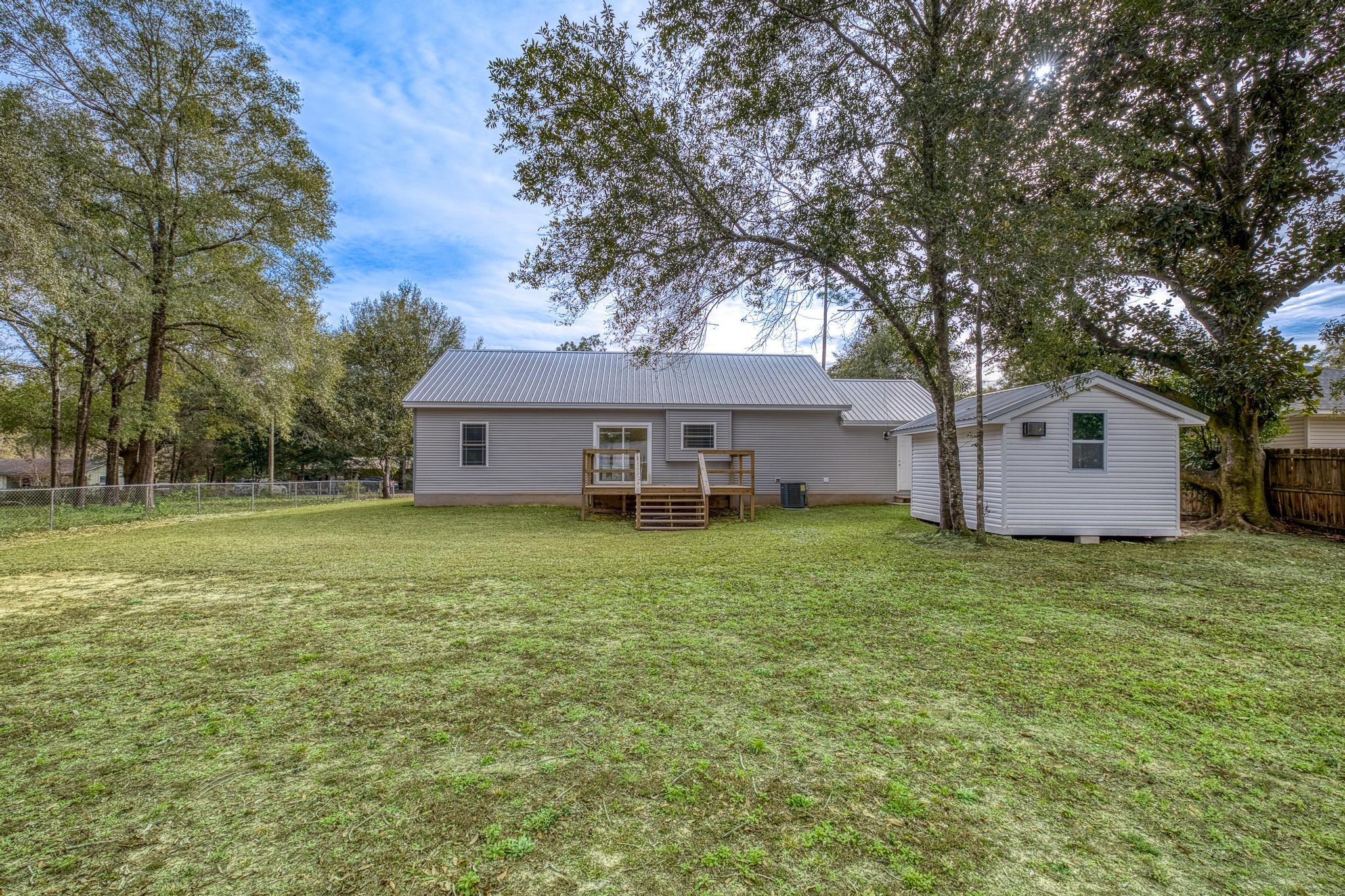 3159 Forrest Avenue Crestview, FL 32539 - Photo 38 of 41 a front view of a house with a garden