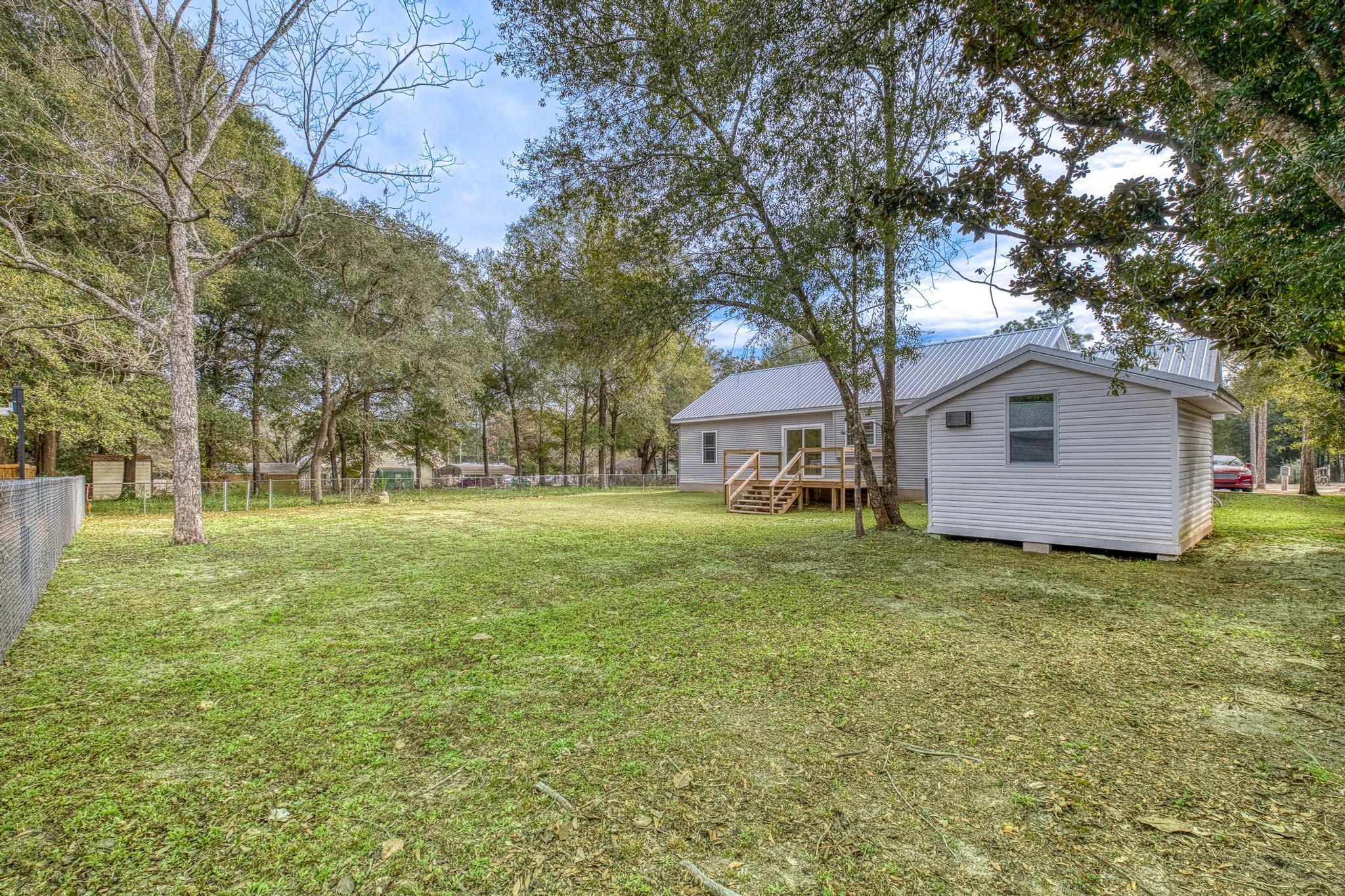 3159 Forrest Avenue Crestview, FL 32539 - Photo 39 of 41 a front view of house with yard and trees