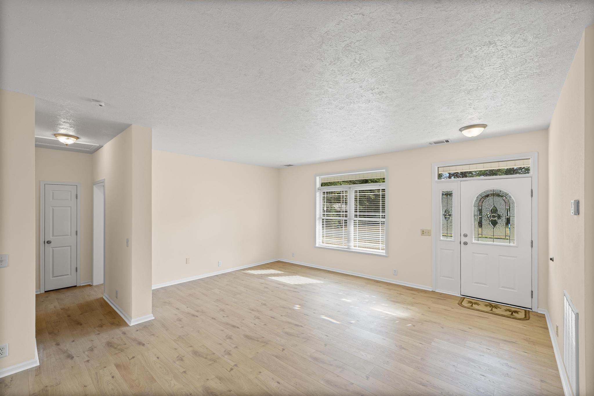3159 Forrest Avenue Crestview, FL 32539 - Photo 8 of 41 an empty room with windows
