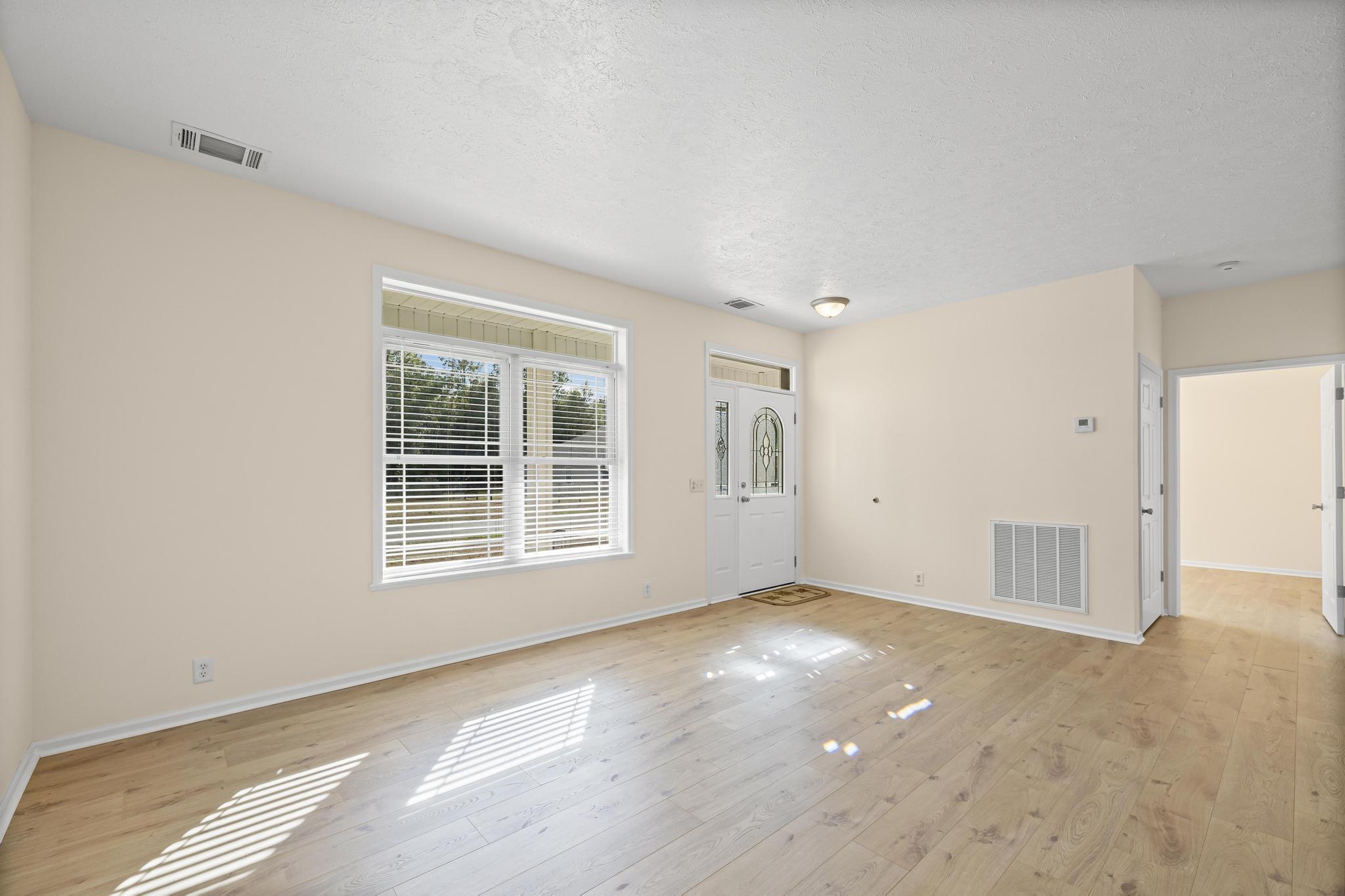 3159 Forrest Avenue Crestview, FL 32539 - Photo 10 of 41 an empty room with windows