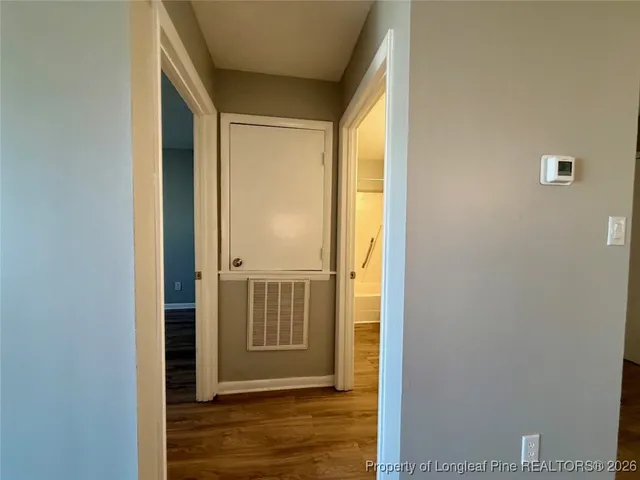 a bathroom with a toilet sink a mirror and shower