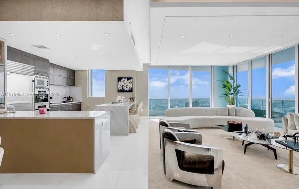 a living room with furniture and a table