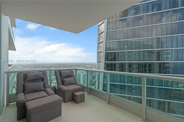 a view of a balcony with furniture