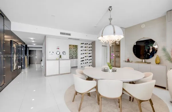 a dining room with a table and chairs