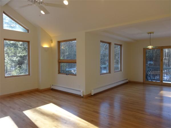 29 Barre Road Templeton, MA 01468 - Photo 11 of 21 a view of an empty room with window and wooden floor